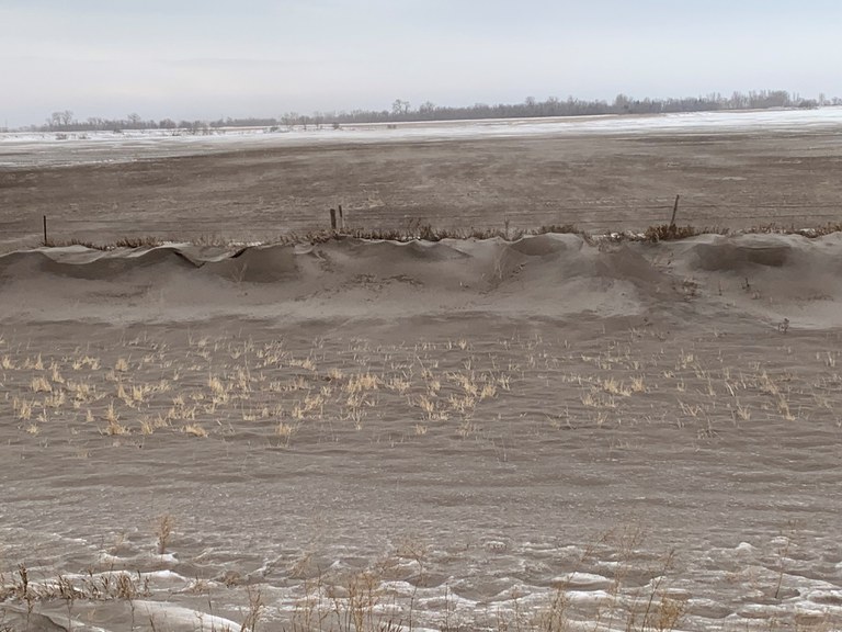 A roadside ditch along Highway 2, about 5 miles west of Grand Forks, North Dakota, full of topsoil from the adjoining field that was tilled in the fall. (NDSU photo)