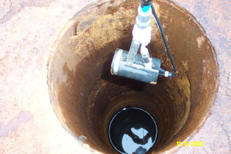 Underwater camera lowered into well