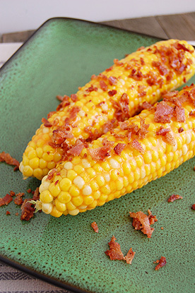 corn on the cob with bacon and buffalo sauce