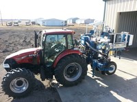 Tractor and planter used for establishing corn hybrid plots