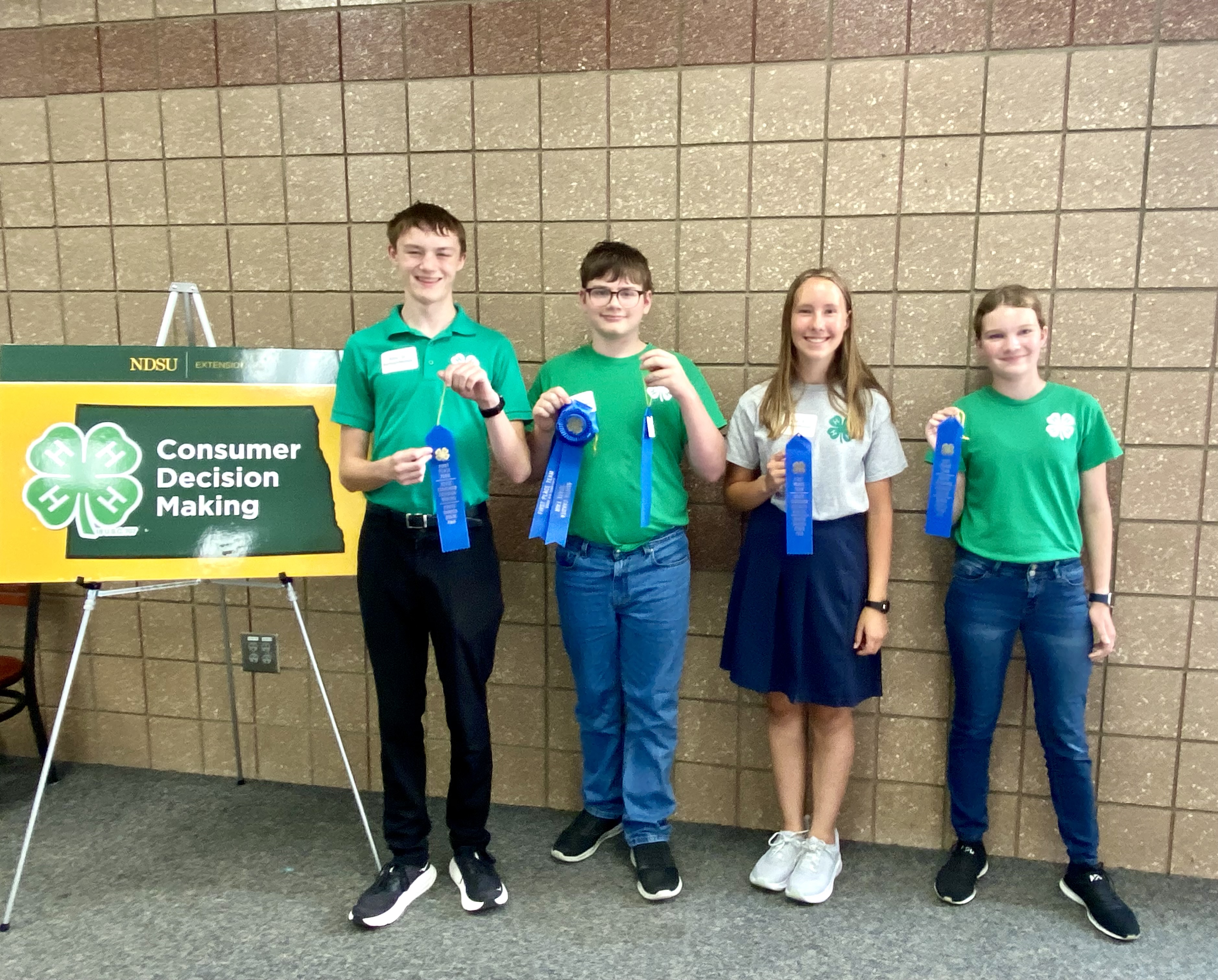 First Place Junior Team: Burleigh/Morton Counties Pictured left to right: Nathan Springer (Burleigh), William Doll (Burleigh), Rita Goettle (Morton) and Everly Boehm (Morton)