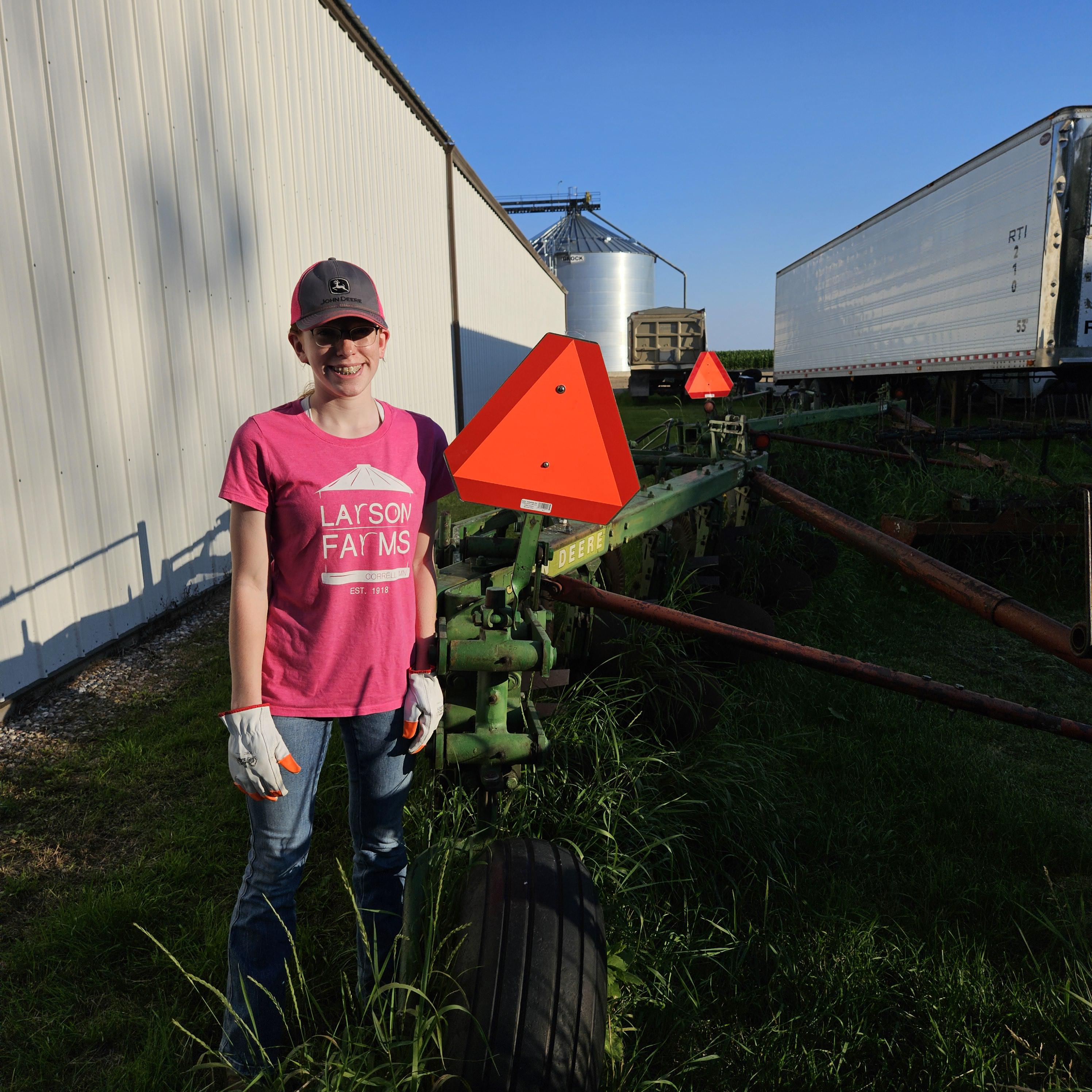 Ashley Steger of Richland County, North Dakota, placed first for properly installing a slow-moving vehicle sign on a John Deere double plow. (Submitted photo)