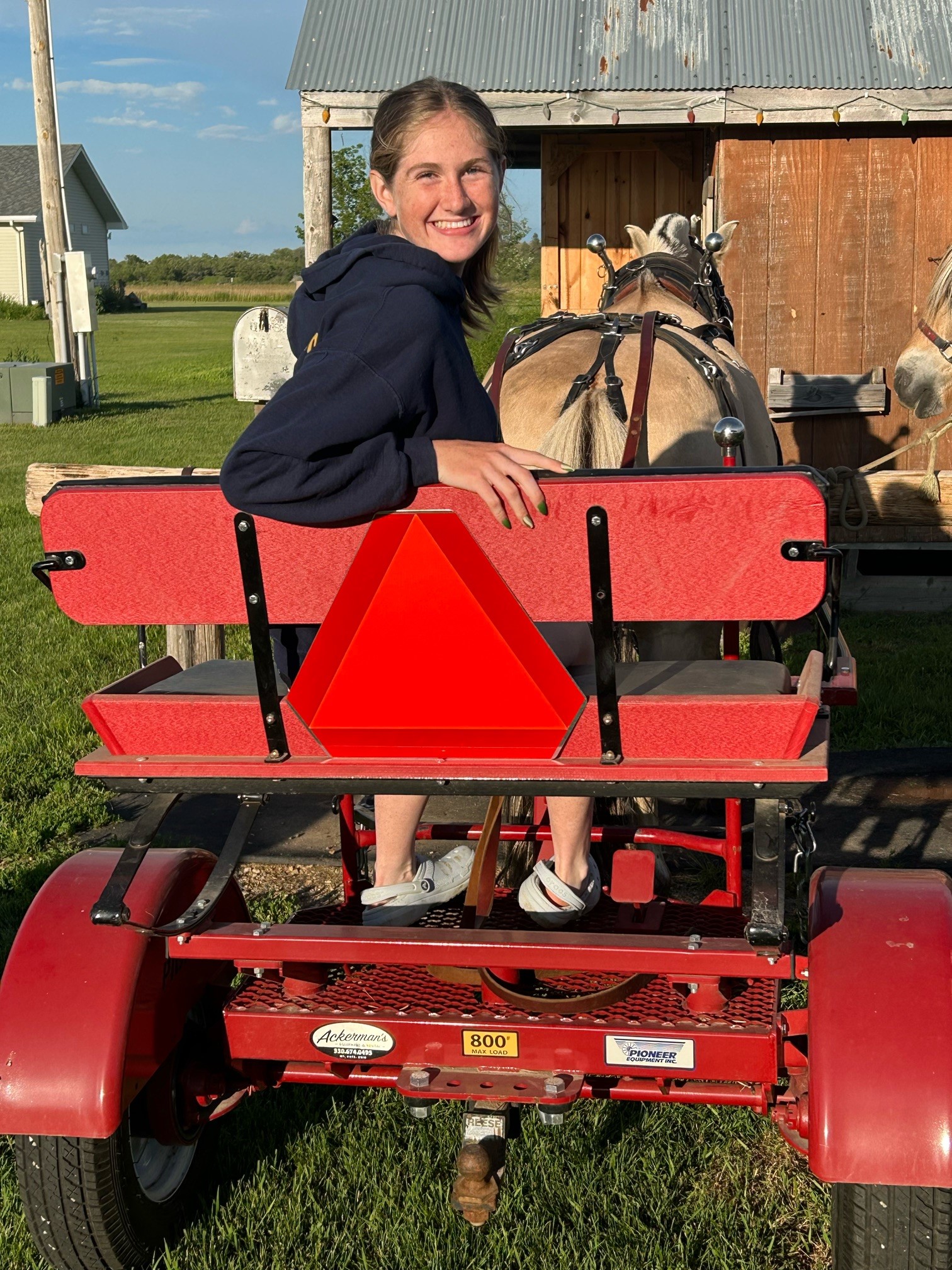 Bella Wimer of McLean County, North Dakota, placed third for properly installing a slow-moving vehicle sign on her horse-pulled cart. (Submitted photo)