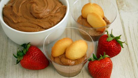 Chocolate Nut Butter Fruit Dip, prepared and in a bowl, with several cups and fresh fruit