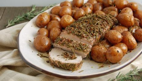Garlic Rosemary Balsamic Roasted Pork Tenderloin, served on a platter and fully prepared