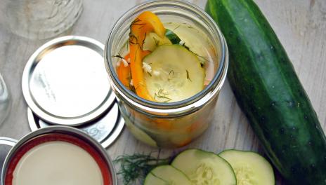 mason jar with cucumbers and peppers