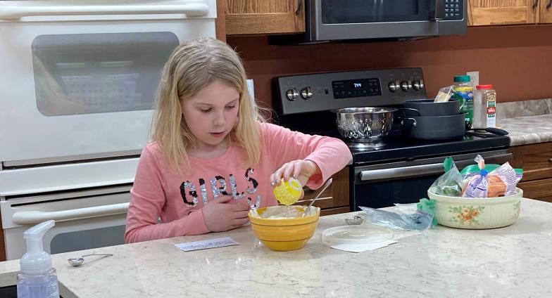 young girl preparing recipe